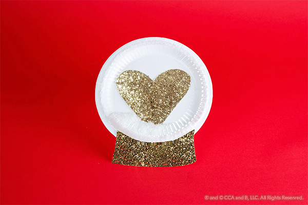 Gold heart snow globe