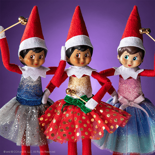 3 elves dancing wearing dresses