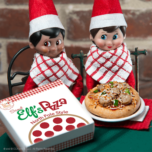 Two elves with mini pizza