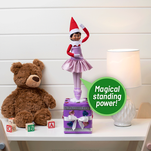 Elf with magical standing tutu outfit on top of music box