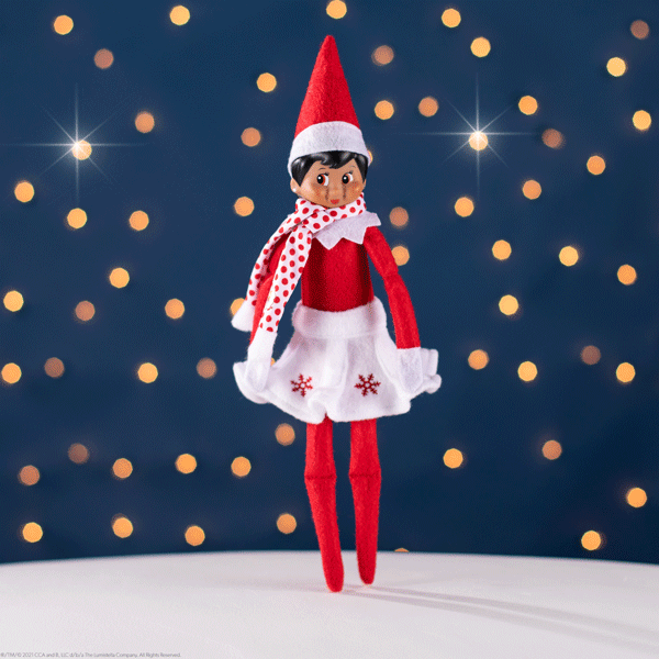 Elf with snowflake skirt and scarf dancing on sparking background
