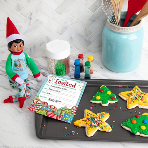 Elf with tray of cookies and party invitation