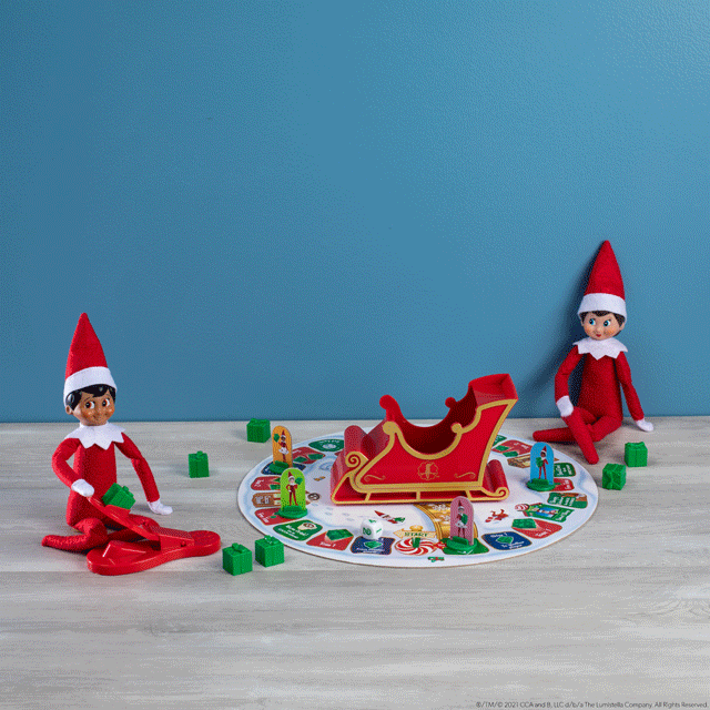 Elves playing Present Pile-Up Board Game