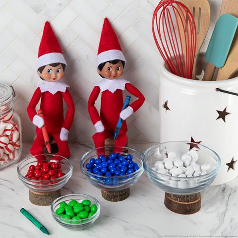 Elves sitting with candy