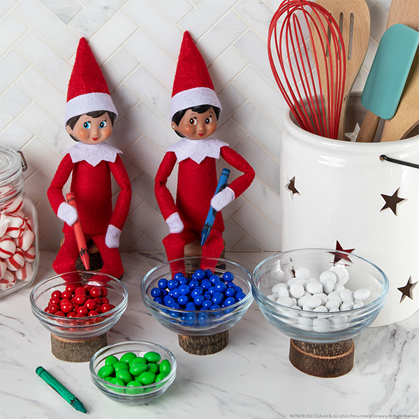 Elves sitting with candy