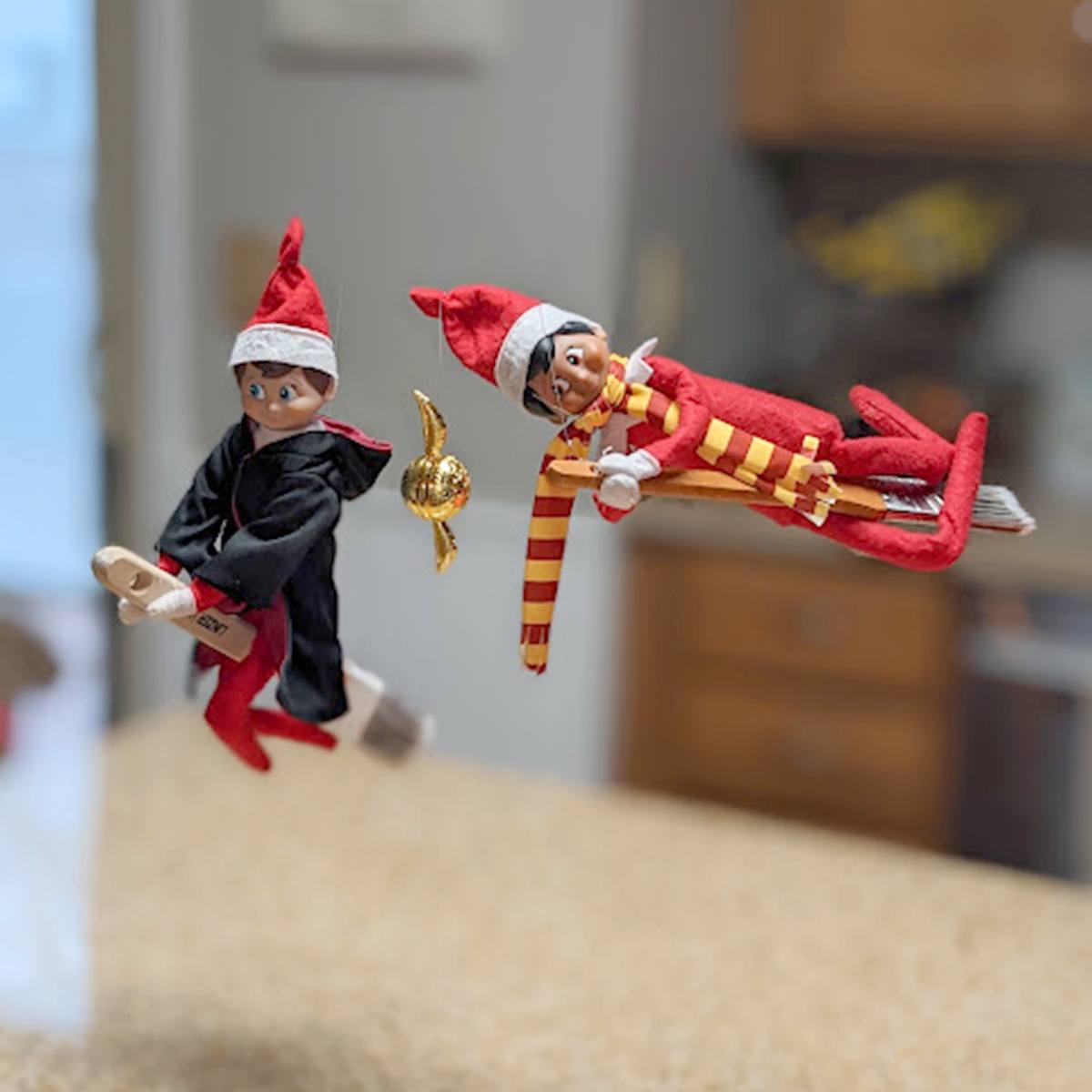 Scout Elves flying on paintbrushes