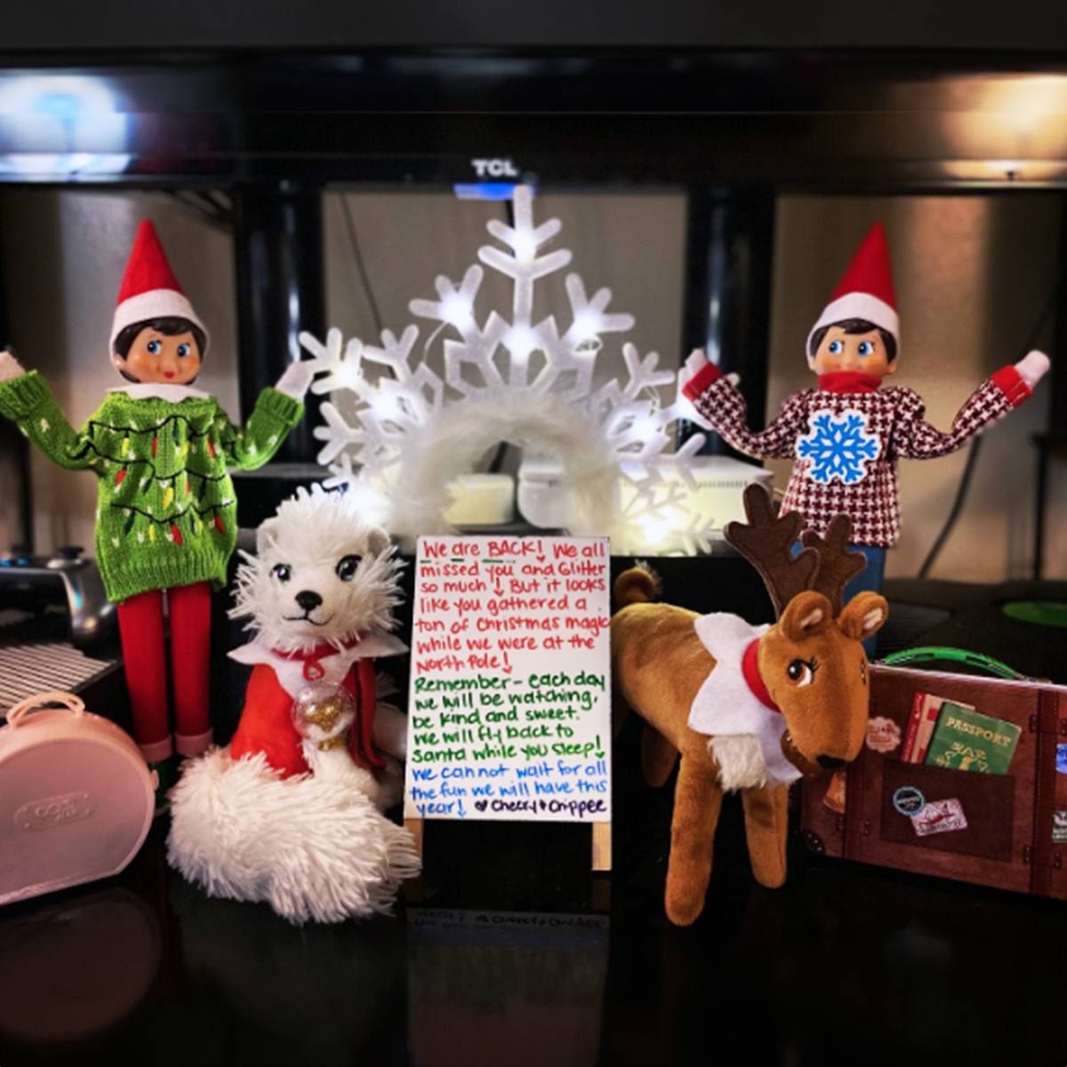 Two Scout Elves with sweaters alongside an Elf Pets arctic fox and reindeer