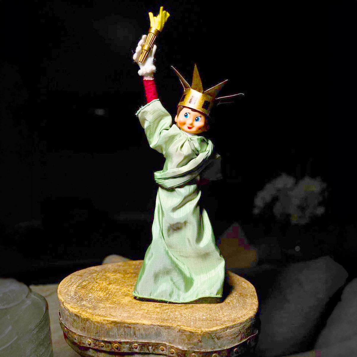 A Scout Elf wearing a Statue of Liberty costume