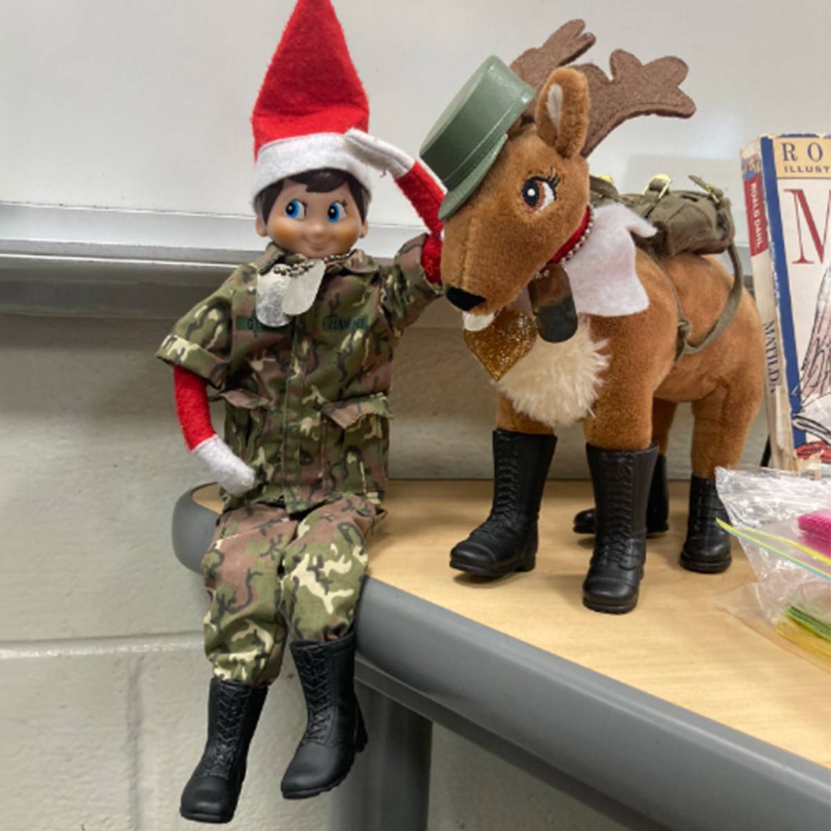 A Scout Elf and Elf Pets reindeer wearing military uniforms