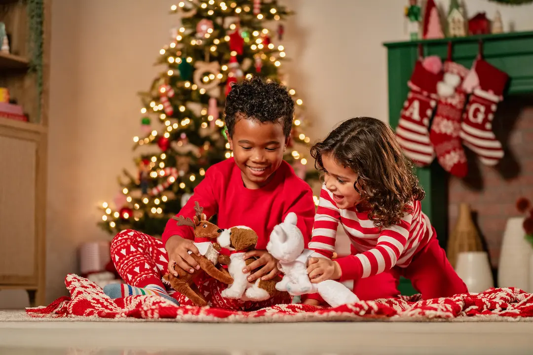 Two kids playing with the Elf Pets
