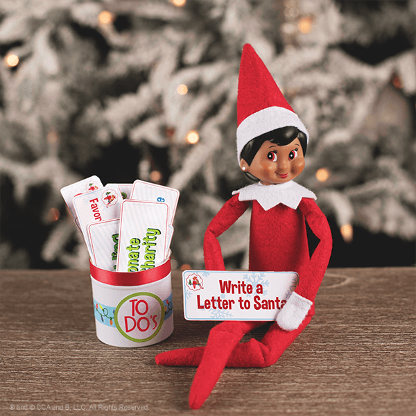 elf seated with notecards