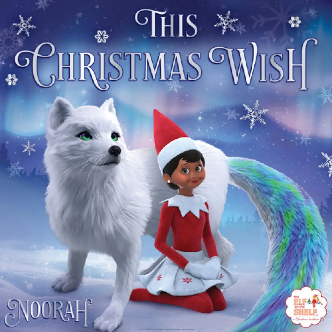 Noorah This Christmas Wish album art, featuing a female Scout Elf sitting on her knees with Noorah surrounding her, looking regal and poised toward the right-hand corner. In the background is a snowy landscape and The Northern Lights at full display.