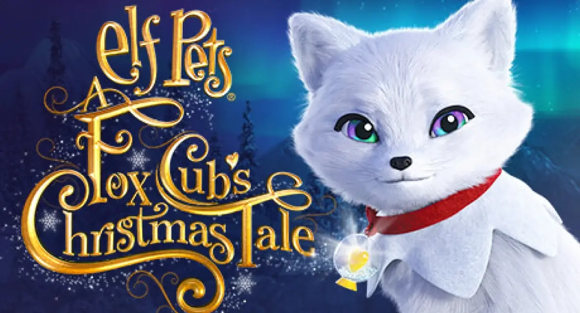 Elf Pets®: A Fox Cub's Christmas Tale cover art. An Elf Pets Arctic Fox cub is in the right-hand corner with the film's branding on the left, reading "Elf Pets® A Fox Cub's Christmas Tale". In the background is a snowy landscape with conifer trees and a snow-capped mountain range.