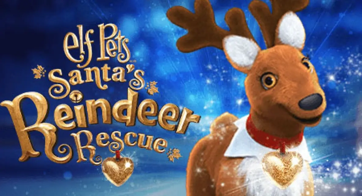 Elf Pets®: Santa's Reindeer Rescue cover art. In the right-hand corner is an Elf Pets Reindeer, sporting a friendly smile at the viewer. On the left-hand side is the film's branding which reads, "Elf Pets® Santa's Reindeer Rescue". In the background is a blurred out snowy landscape over a dark blue and navy sky.