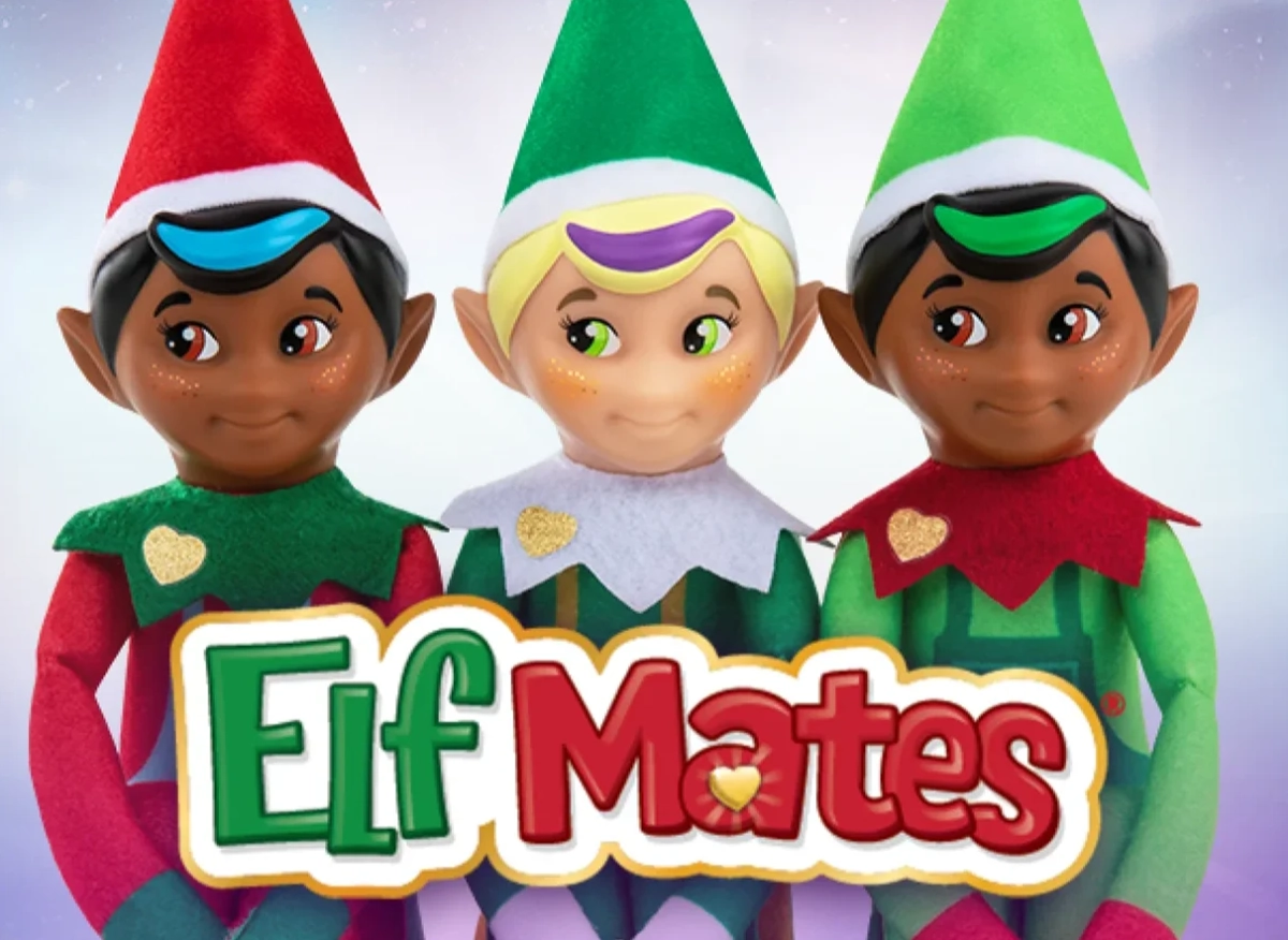 A trio of Elf Mates Chef, Toy Maker and Cobbler pose together. The Elf Mates logo is in front of them.