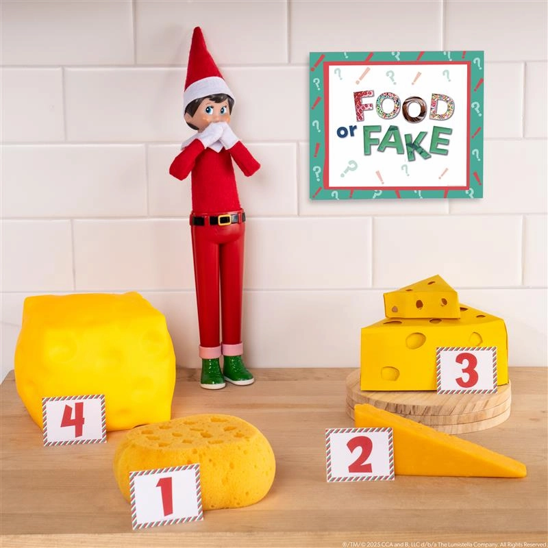 A Scout Elf stands with four different items that look like cheese with a sign saying Food or Fake? asking you to guess which one is real