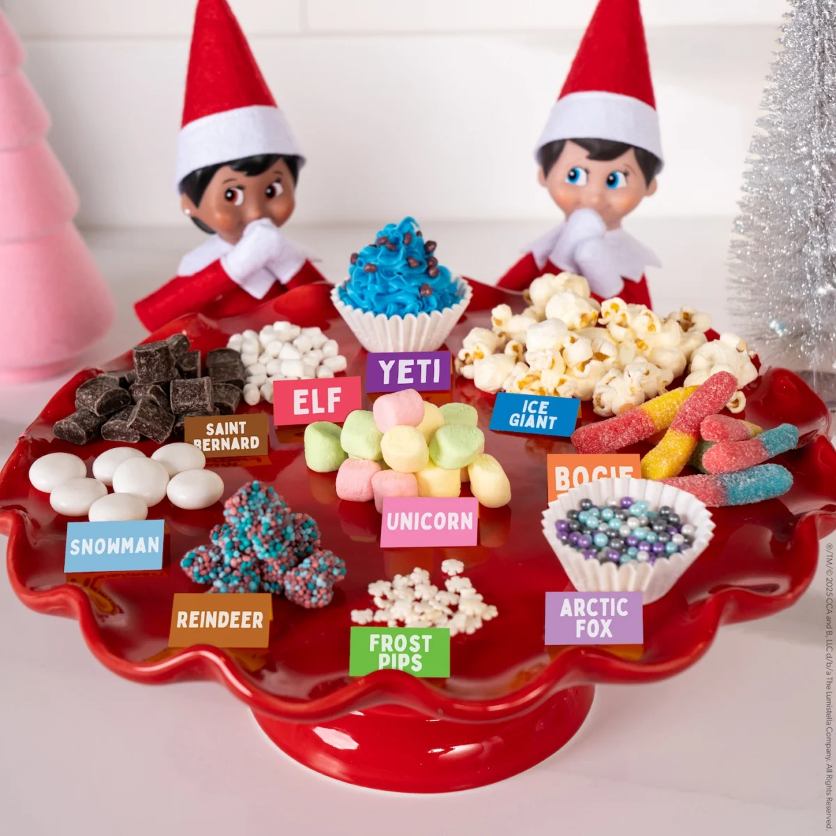 Two Scout Elves sit with small bowls of candy each representing the poo of a different creature