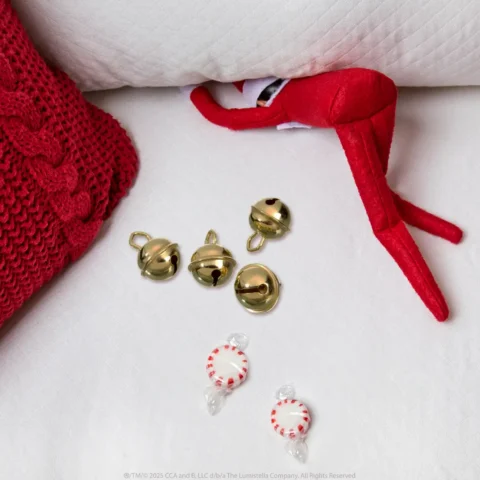 A Scout Elf hides a jingle bell in the couch cushions to set up a scavenger hunt 