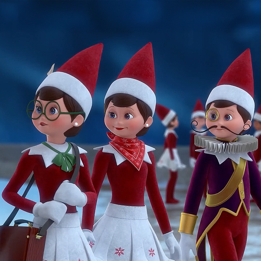 A video still of a trio of North Pole characters including Scout Elf Newsy Noel, Scout Elf and Scout Elf Joe. This still is from the YouTube Video entitled "Why Didn't My Scout Elf Move?".