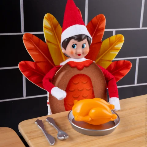 The Elf on the Shelf wearing a turkey costume