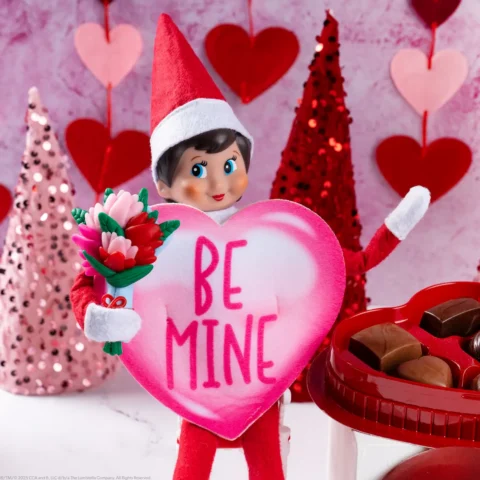 The Elf on the Shelf wearing a Valentines heart costume