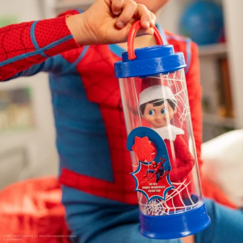 A Scout Elf sits safely in the Spider-man themed Scout Elf Carrier with his magic safely protected but ready to travel