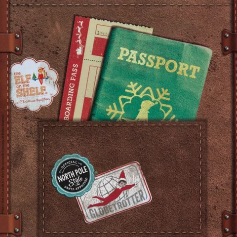 A brown folder holds an elf-sized passport and a sticker that says Globetrotter