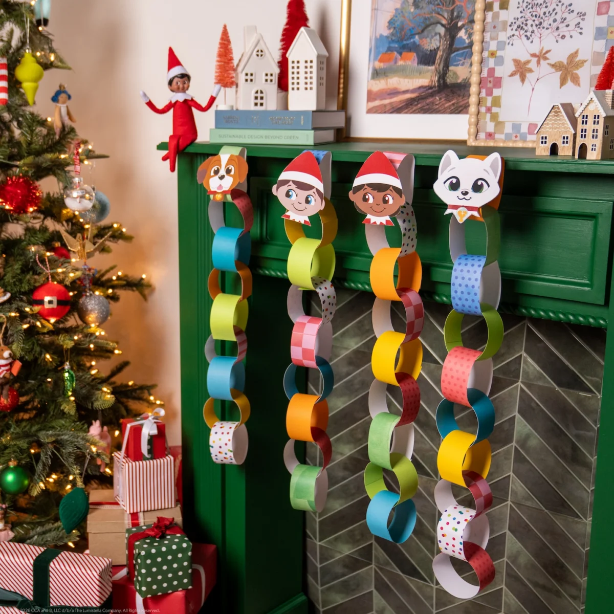 A Scout Elf sits beside four paper countdown chains decorated with the faces of Santaverse friends