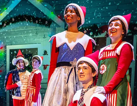 Elves acting on the stage during The Elf on the Shelf musical production