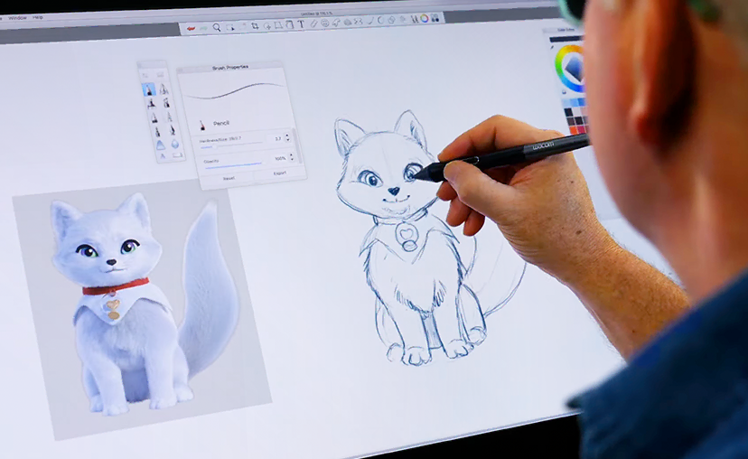 Man drawing an Elf Pets Arctic Fox Cub with a graphics tablet