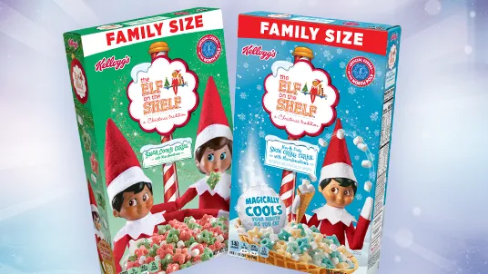 Boxes of two Kellogg's breakfast cereals. On the left is the box of the Sugar Cookie Cereal featuring two Scout Elves behind a bowl of red and green cereal pieces with marshmallows. On the right is a box of the Snow Creme cereal. There is a Scout Elf juggling snowballs behind a waffle cone bowl containing blue and tan cereal pieces with marshmallows.