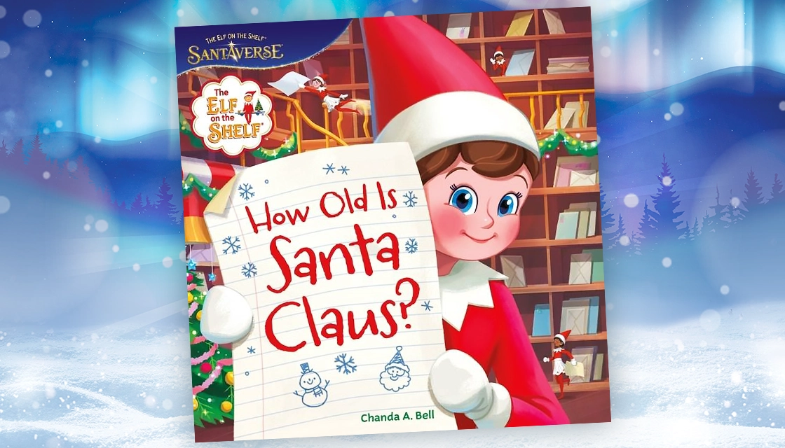 Pictured is the "How Old Is Santa Claus?" book cover. On the cover, a Scout Elf holds a sheet of paper with the book title written on the sheet in red. Behind her appears to be a Christmas tree and wooden library shelves. The book title is over a wintery snowscape. Snow can be seen covering the ground and the Northern Lights are overhead.