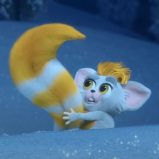 A yellow and white Bogie behind a snowbank holding his tail up in the air and looking at it. He has a shocked look on his face.