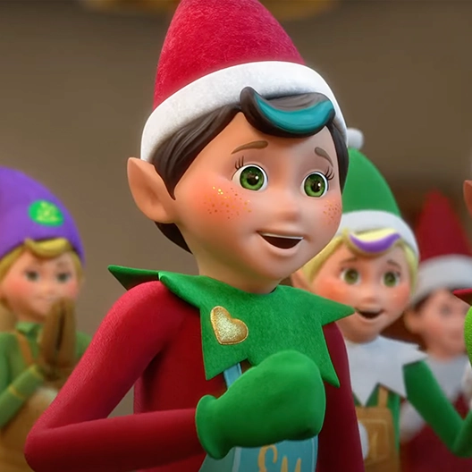 A chef from the chest up facing to the right. He has a surprised look on his face and his right hand in a fist raised up close to his chest. Behind him are other Elf Mates.