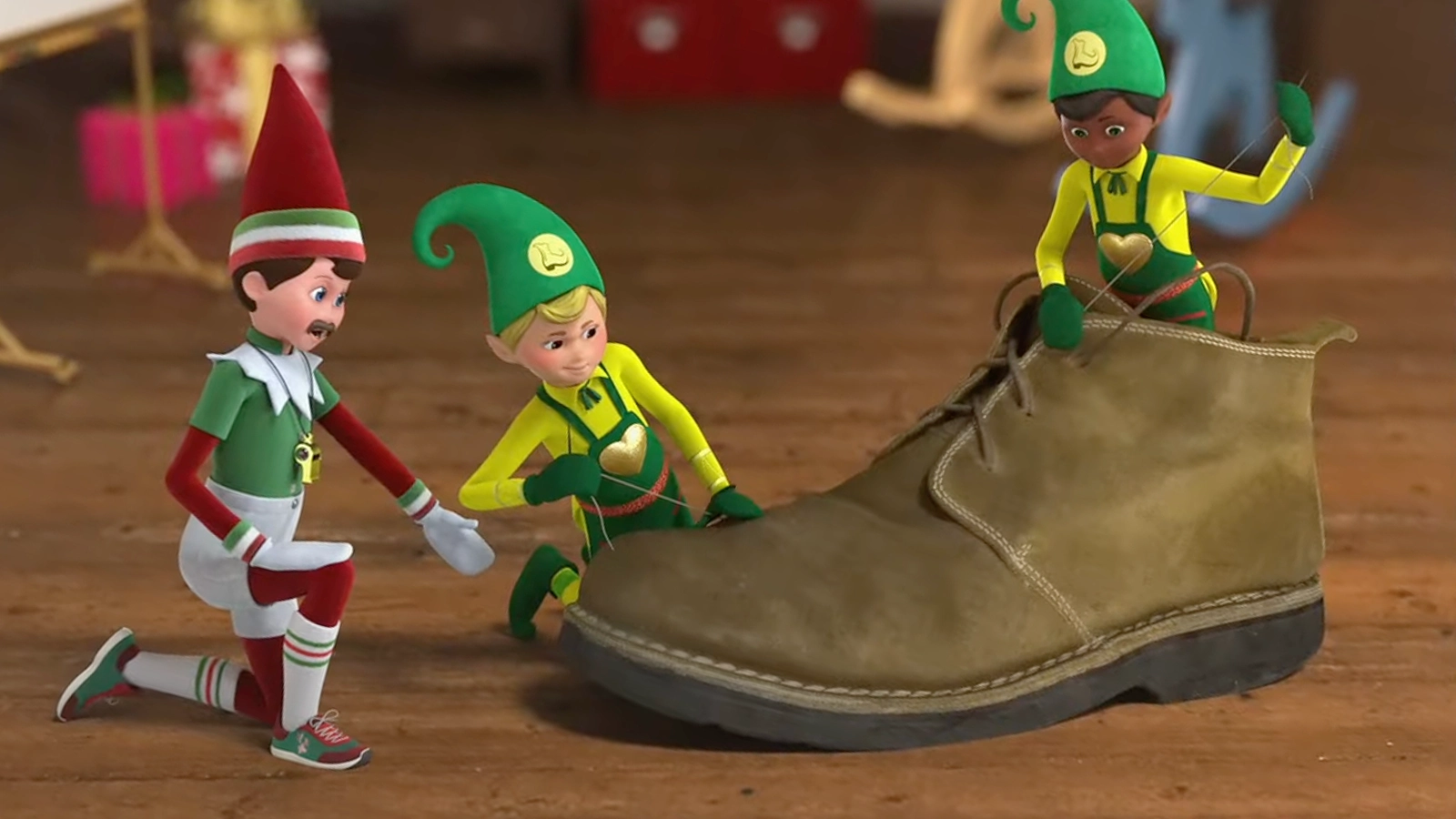 A pair of Elf Mates® Cobblers are going through the rigorous program of Top Elf Academy to learn their cobbler skillset. They are also posing with a giant chukka boot, as they make a repair. Hovering over them is Gym Dandy, who is coaching them through it.