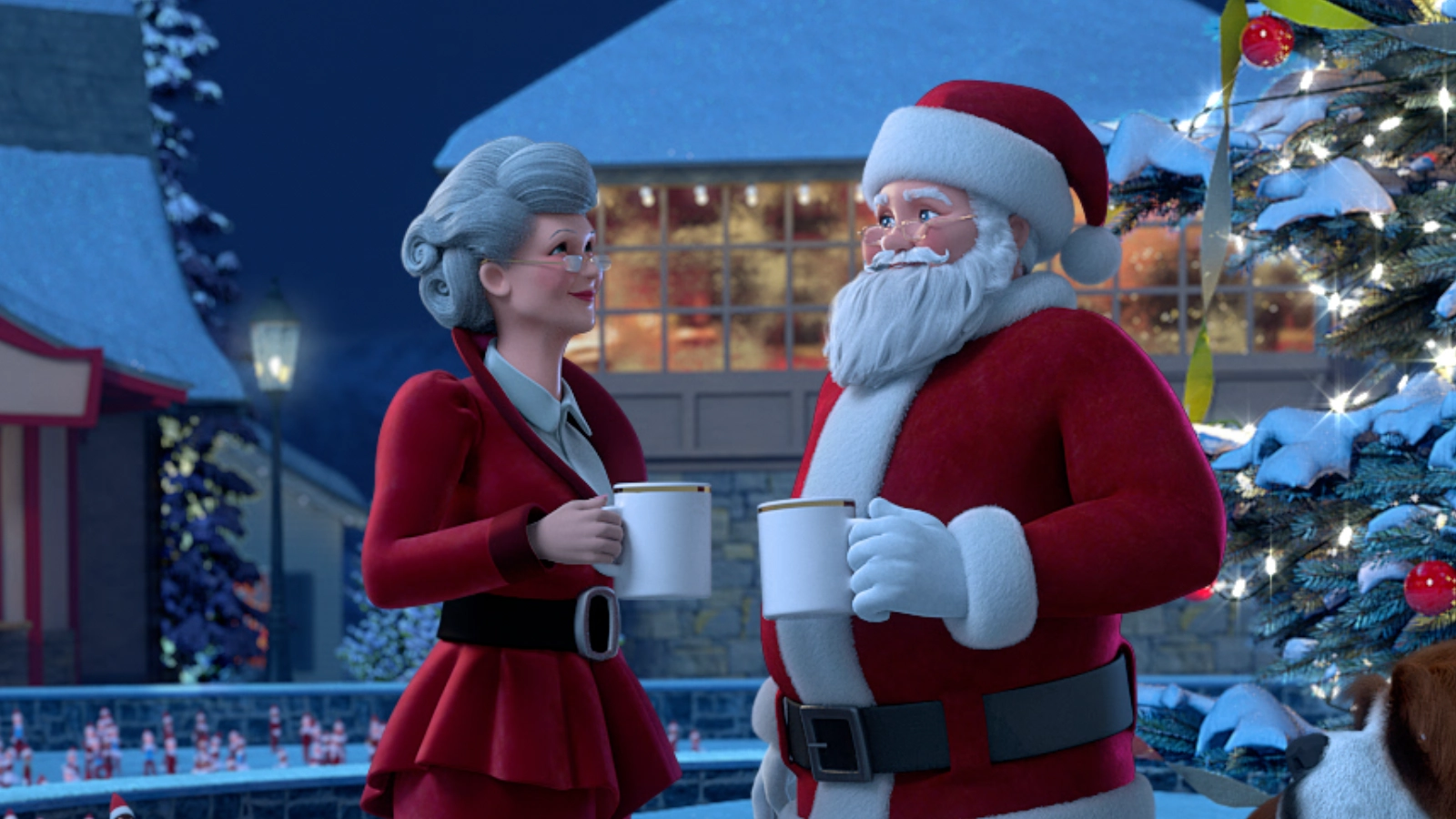 Mrs. Claus looks lovingly at Santa Claus, as they each hold mugs of hot cocoa. They are both adorned in luxurious red clothing, Santa in his iconic suit and Mrs. Claus in a velvet red outfit. They are in the center of the Kingdom of the One True North, with buildings lit up and decorated for the season. Also seen is a decorated, snow-covered Christmas tree and the top of Barry's, Santa's loyal Saint Bernard, head.