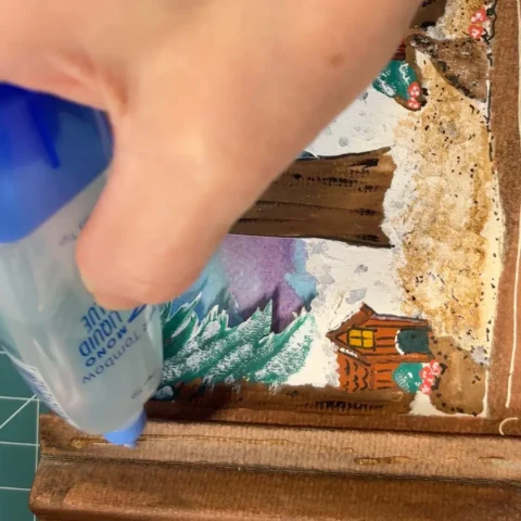 Glue being applied to tunnel book