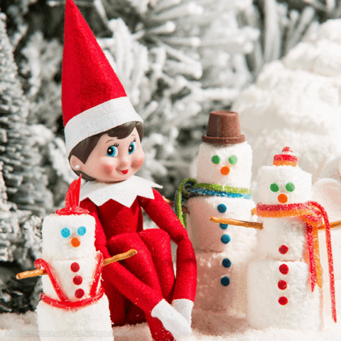 Scout elf girl surrounded by three marshmallow snowmen