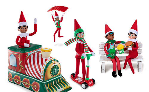 Scout Elves arriving with elf-sized props including a toy train, a scooter and a parachute