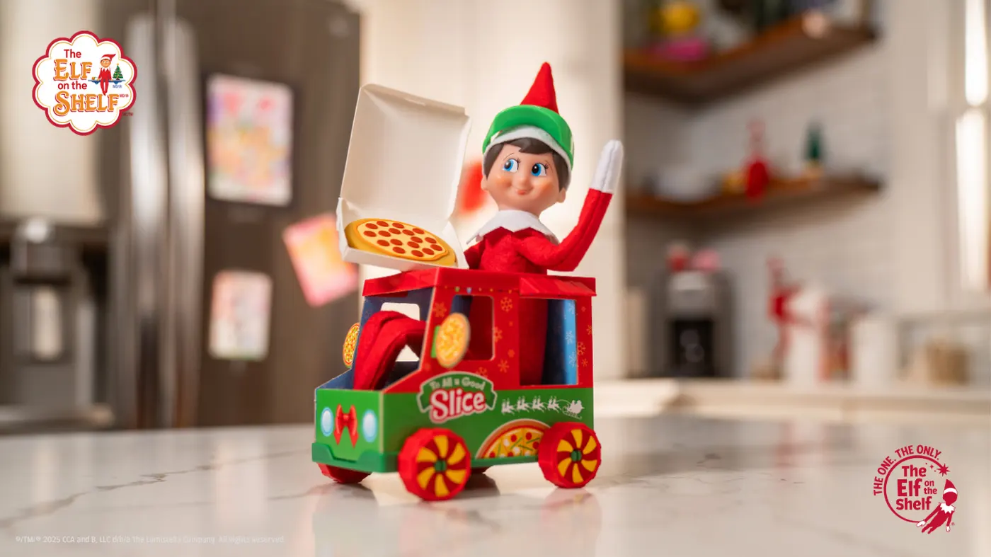 Elf on the Shelf in an The Elf on the Shelf® Polar Props™ Polar Pizza Truck.