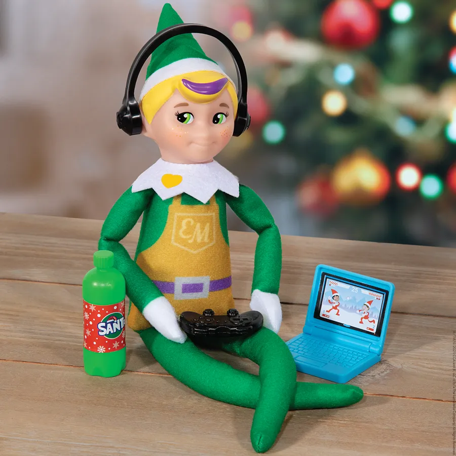 Elf Mates Toy Maker doll wearing headphones with a toy laptop and festive Christmas accessories