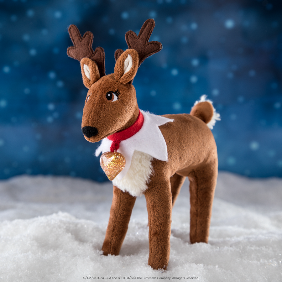 Elf Pets Reindeer wearing a golden heart charm against a dark blue North Pole background
